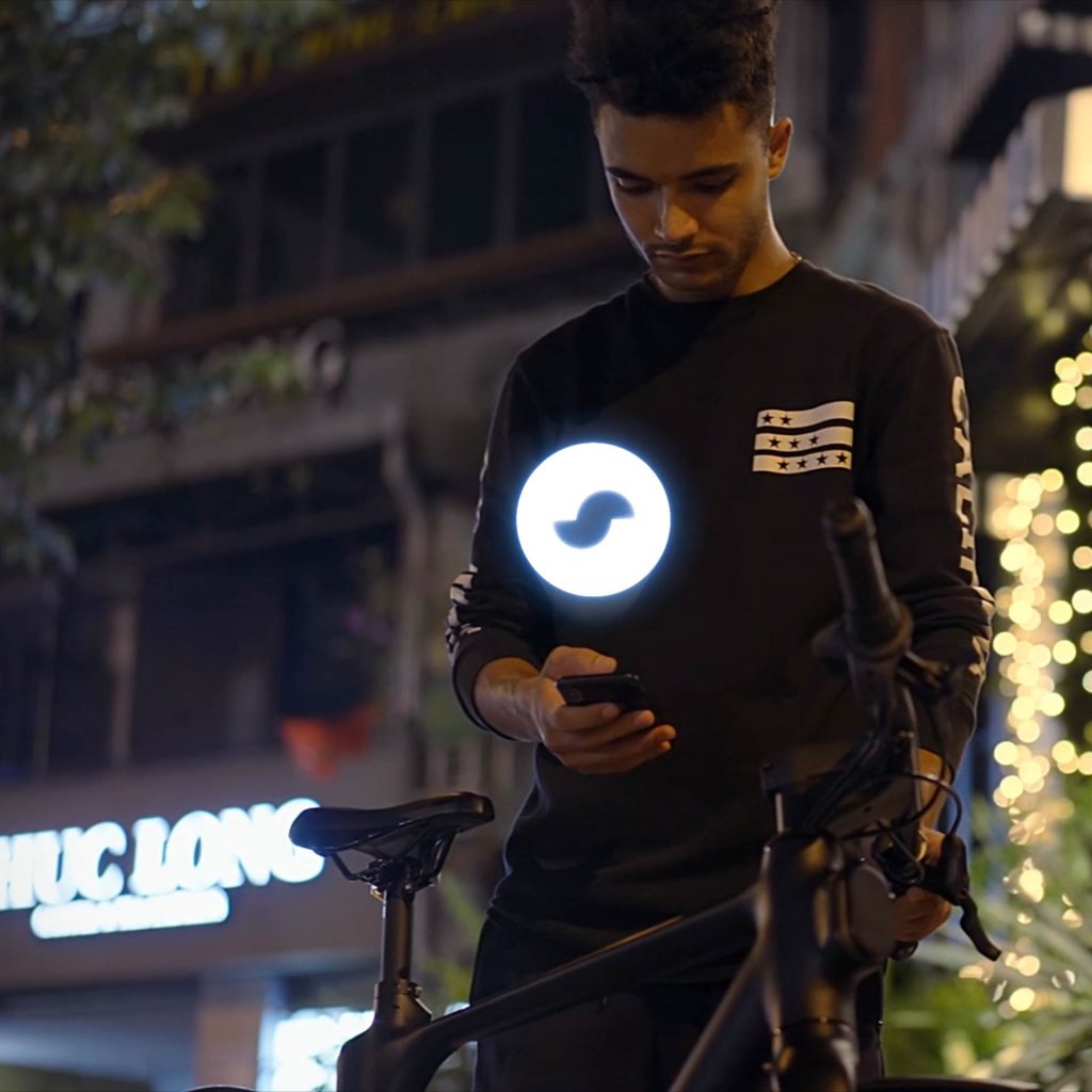 Social media ads featuring a man unlocking a MODMO bike with a glowing MODMO logo, showcasing its high-tech and smart functionality.