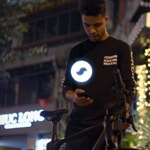 Social media ads featuring a man unlocking a MODMO bike with a glowing MODMO logo, showcasing its high-tech and smart functionality.