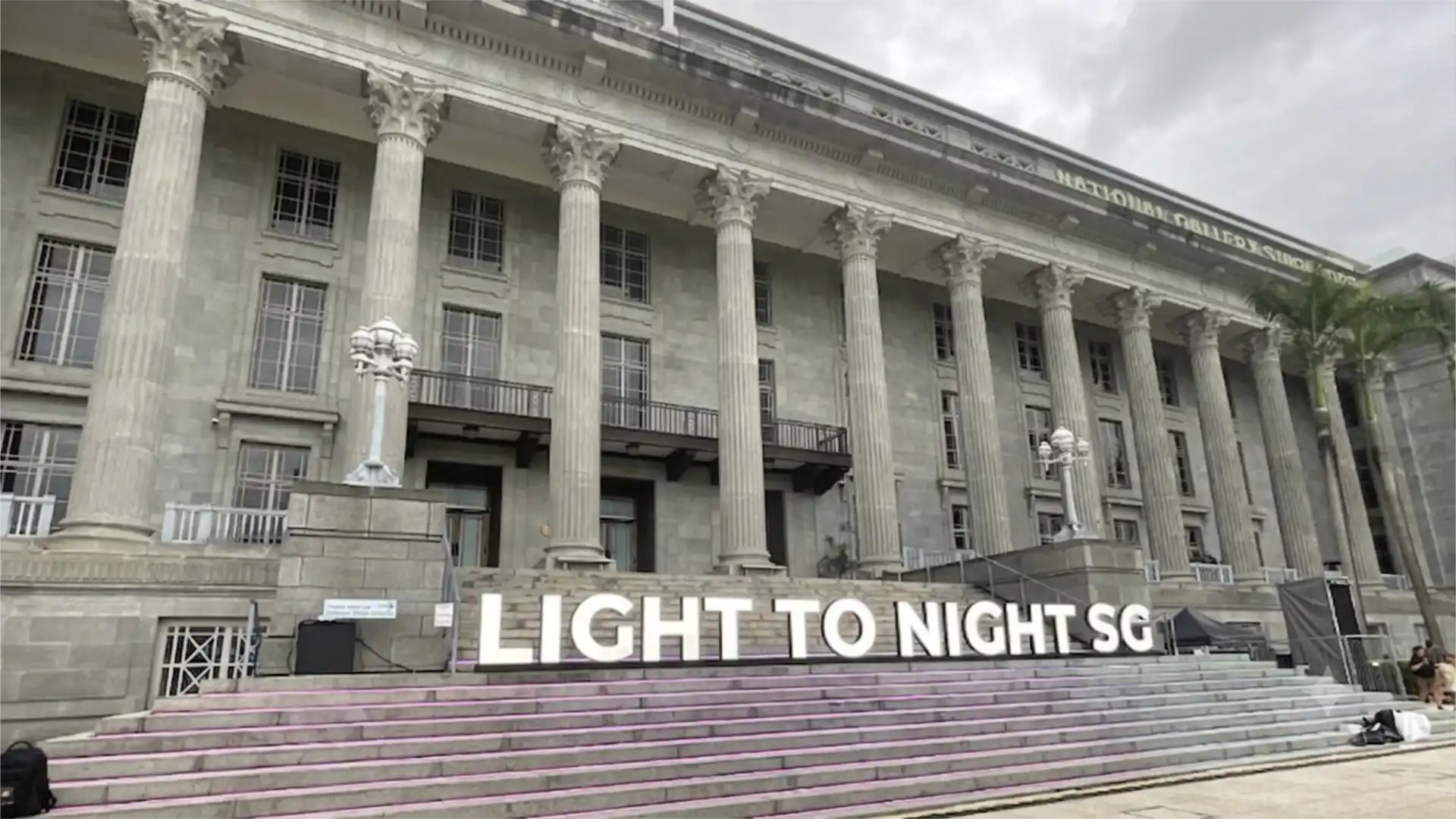 On-site scouting photo of National Gallery Singapore's façade taken during pre-production for the Light To Night 2026 video mapping projection